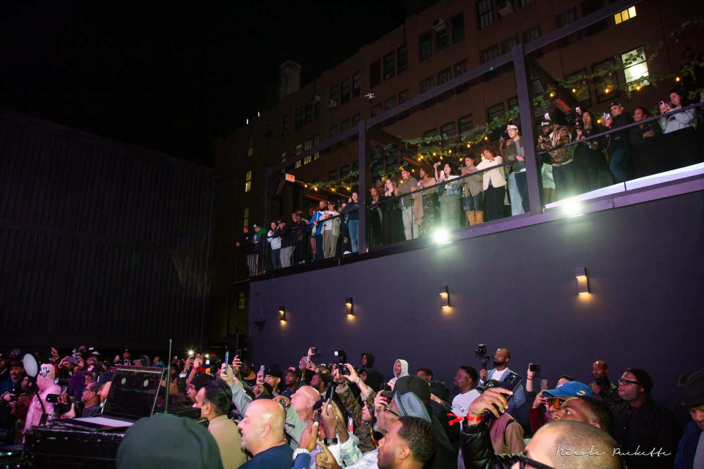 A packed crowd watching the Arena screen